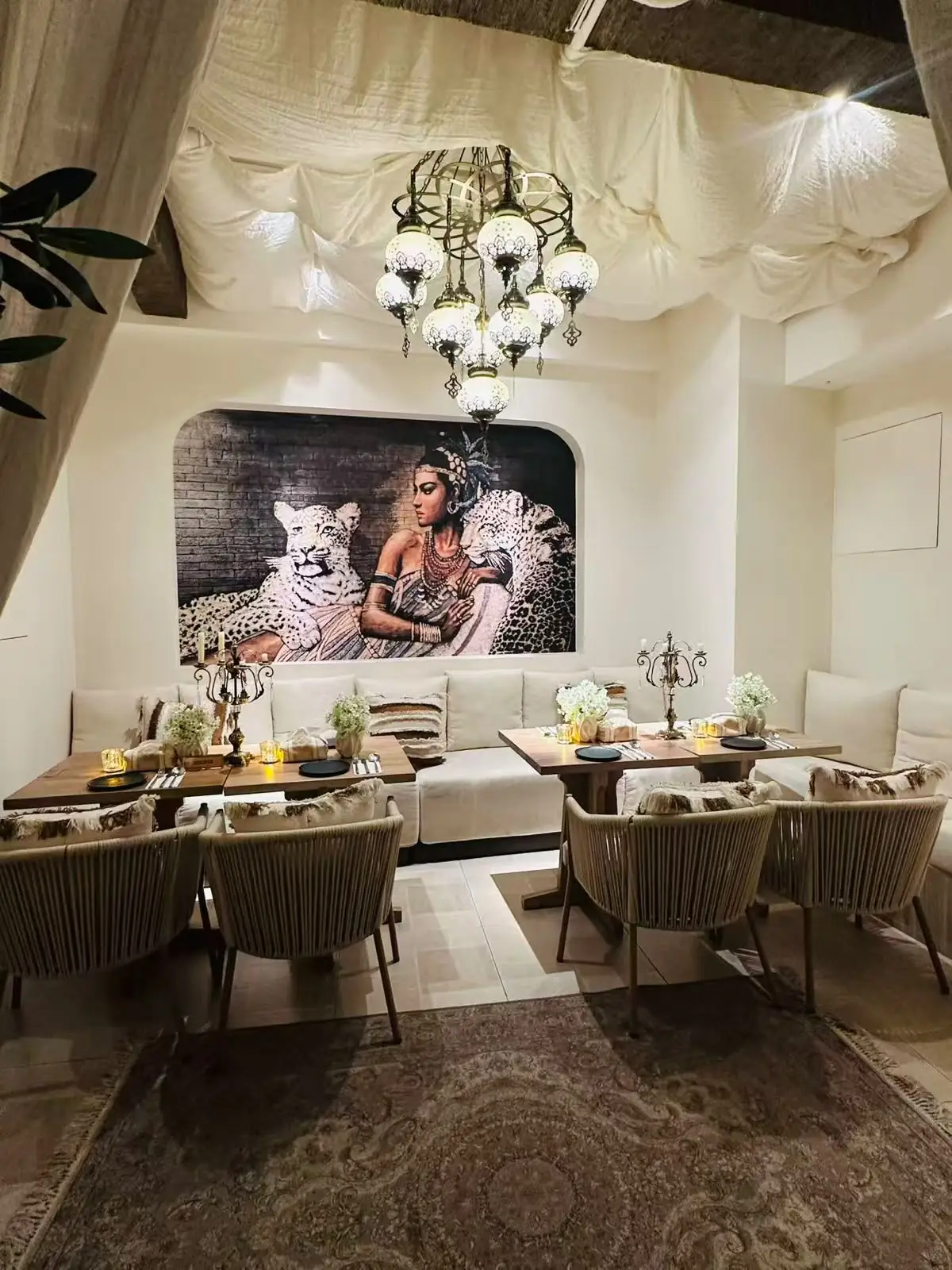 Dining tables under a crystal chandelier