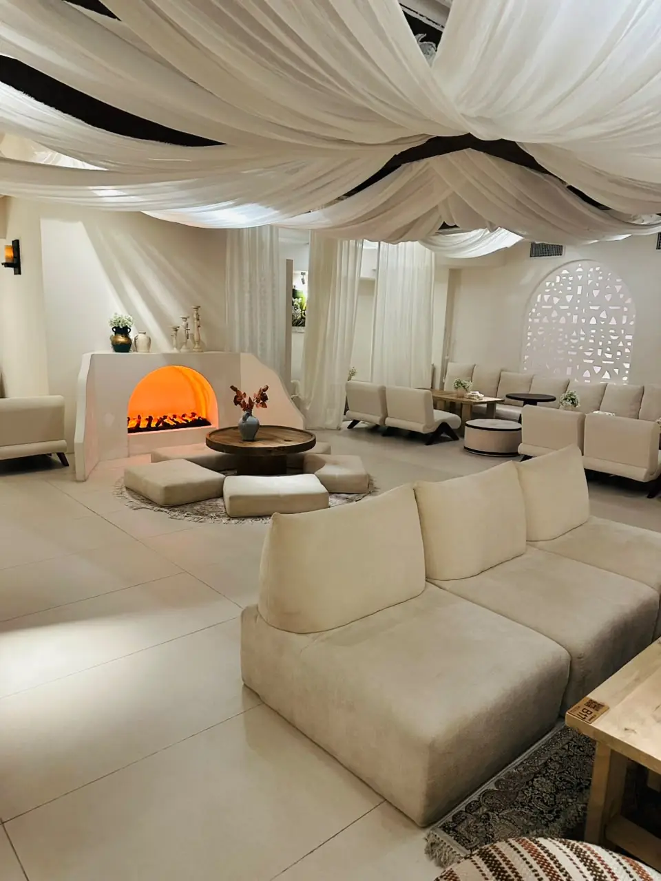 Lounge seating around a lit fireplace